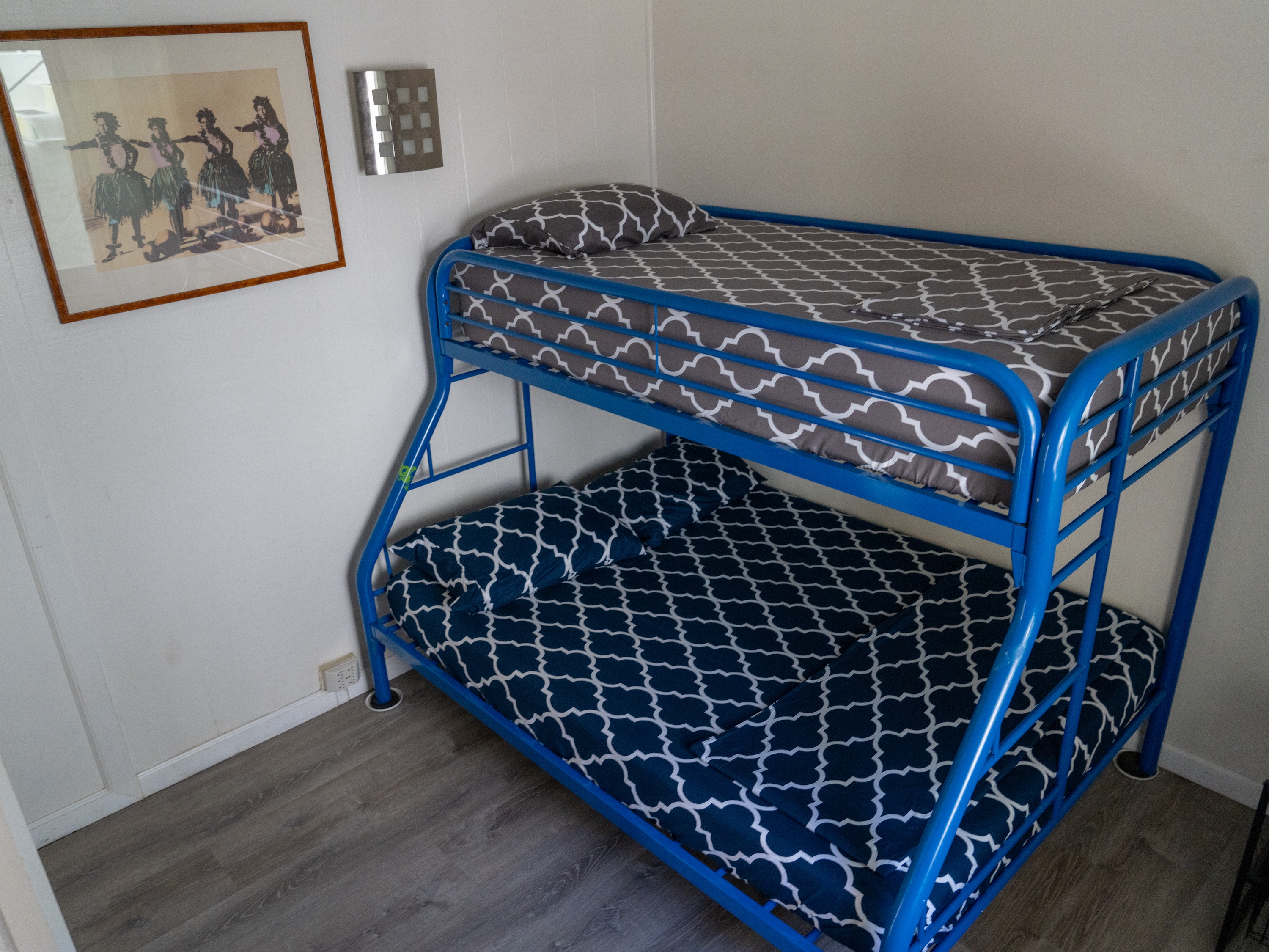 Female semi-private room with a blue bunk bed